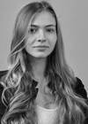 A person with long hair

AI-generated content may be incorrect.